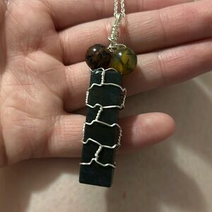 Jade wrapped crystal